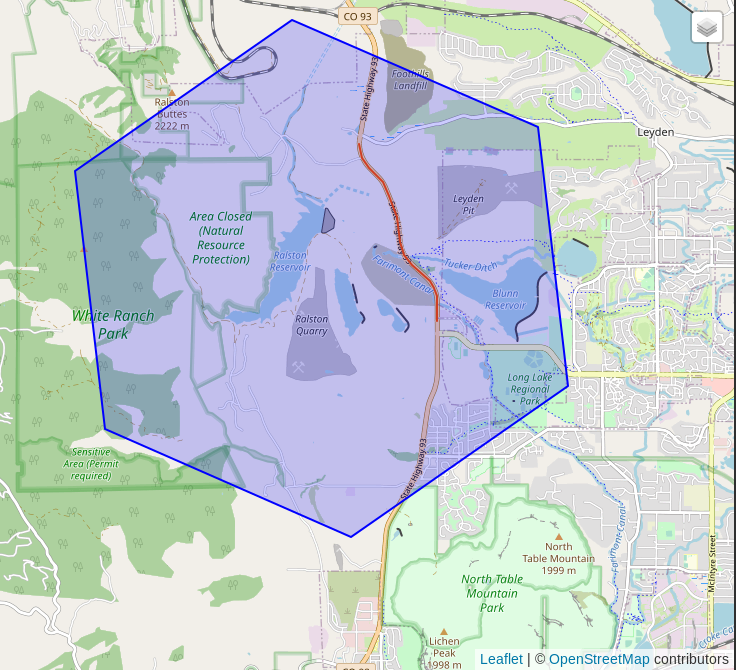 Screenshot from DBeaver's spatial viewer showing a single blue hexagon returned from the above query.  The zoom level shows this hexagon is large enough to contain a couple quarries, a few reservoirs, and a small amount of residential area. The selected highway segment (osm_id = 289242317) fits entirely within the hexagon.